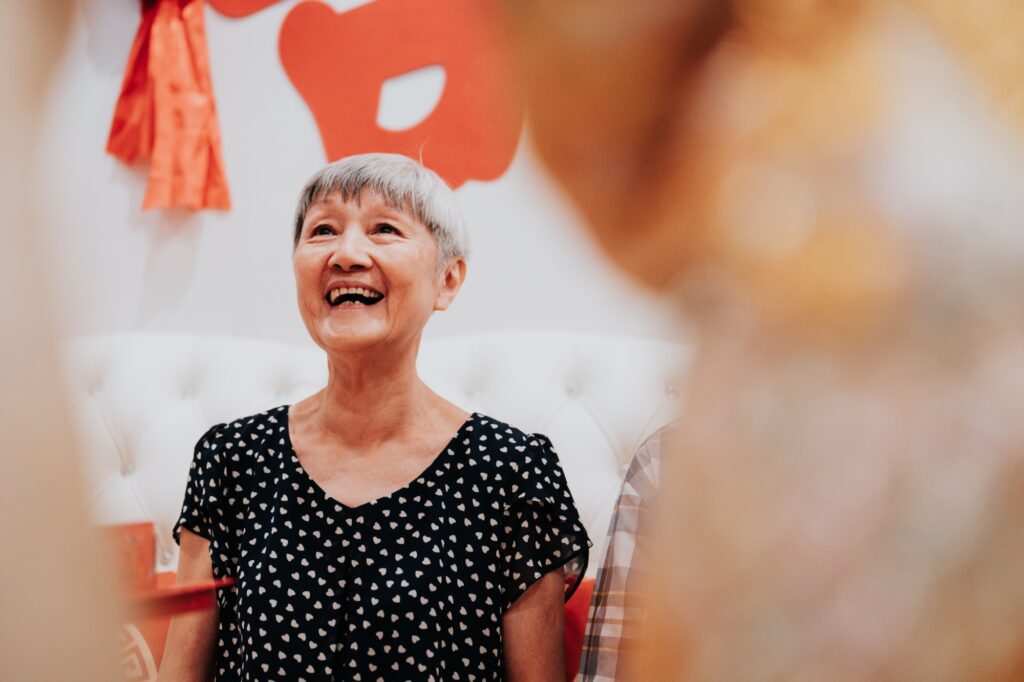 Grandmother laughing during the tea ceremony at a Chinese wedding in Kuala Lumpur
