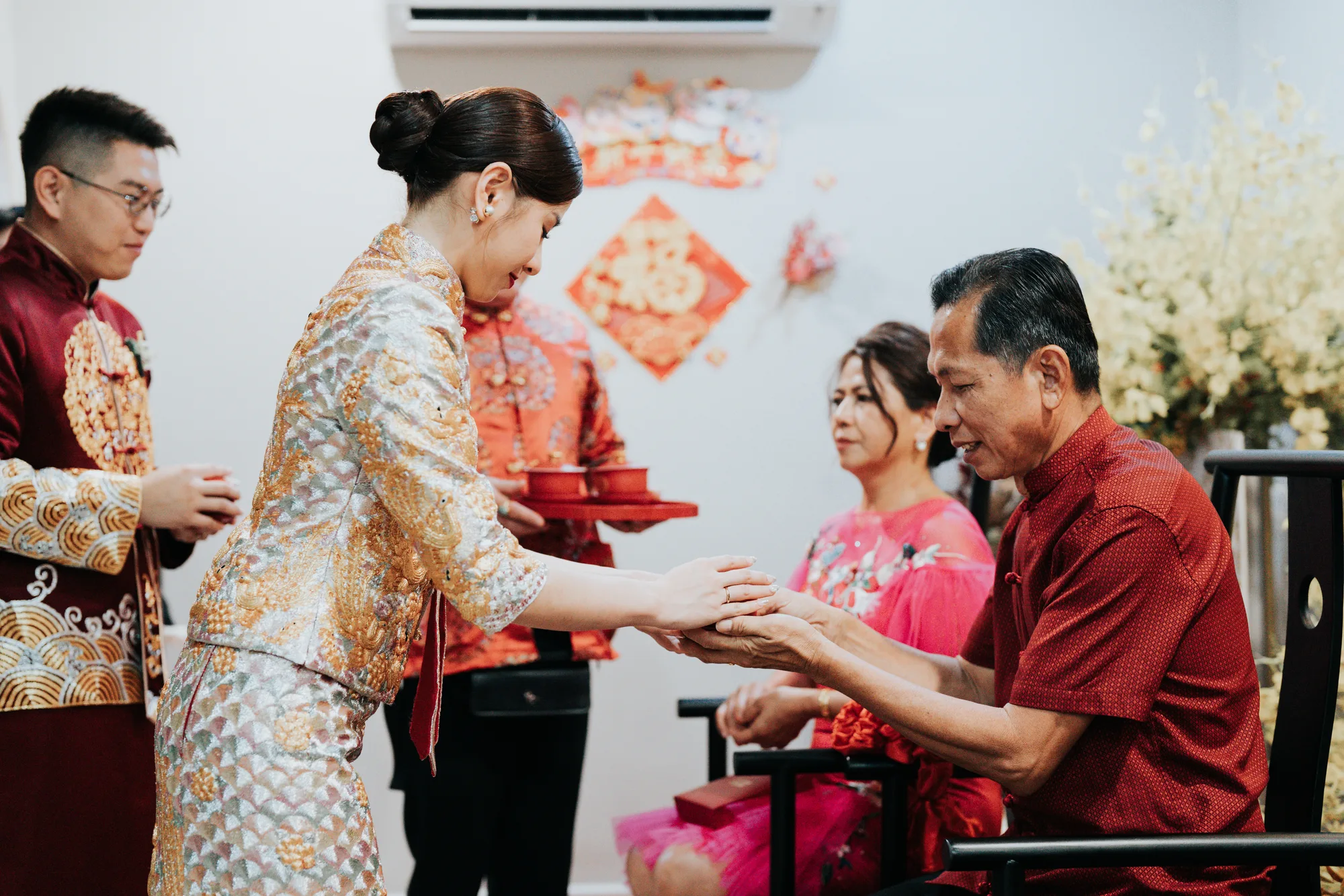 Chow Li and Yah Theng serving tea to their elders