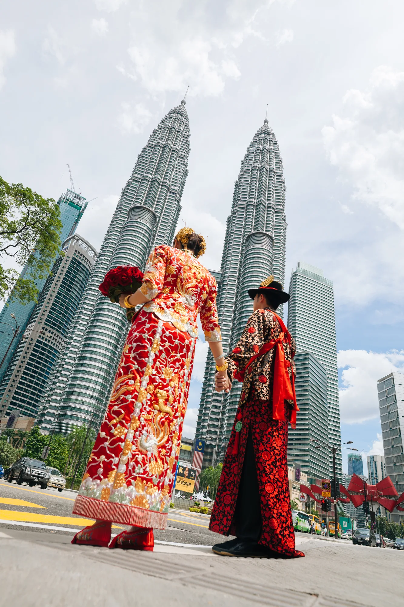 Jennie and Jacky in Chinese wedding dress under the Petronas Twin Towers