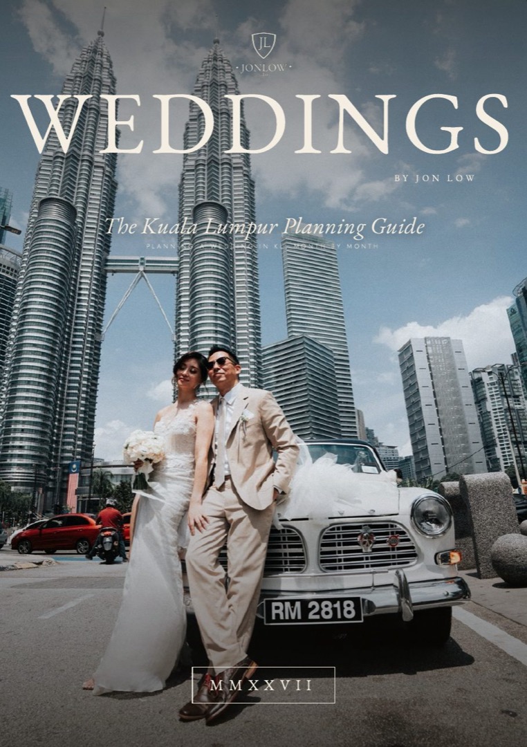 The guide's cover: a couple under the Petronas Twin Towers
